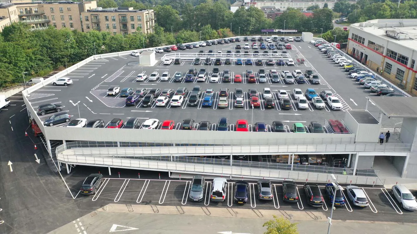 The upper-deck car park and petrol filling station at Costco’s European Headquarters in Watford, showing the new two-storey office extension.