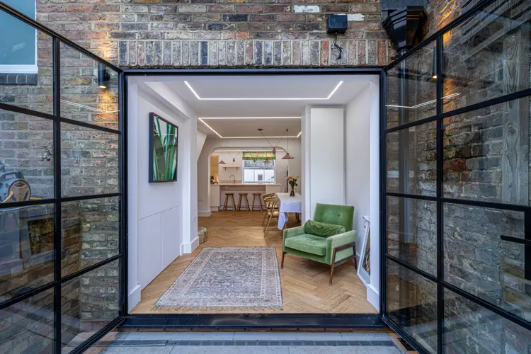 A private extension and basement conversion in London, showing the new kitchen and dining area.