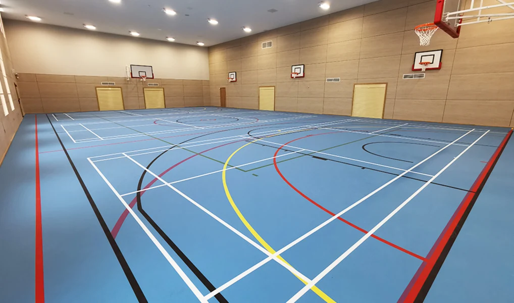 The Jubilee Community Leisure Centre, showing the three-court sports hall and the community room.